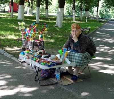 Older people sell their wares in the parks.