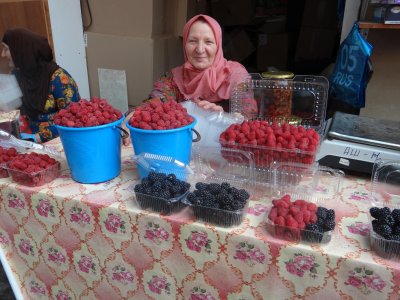 Friendly berry seller in a Makhachkala market