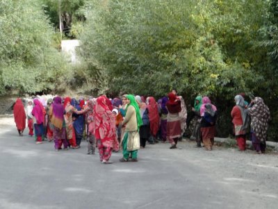 These women have gathered to watch friends leave on a pilgrimage (they are Muslim in this area).