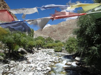 Prayer flags over a rushing stream