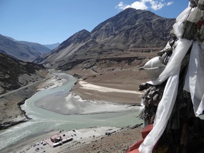 Prayer flags at a river confluence