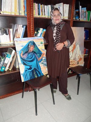 A contemporary artist with her work.