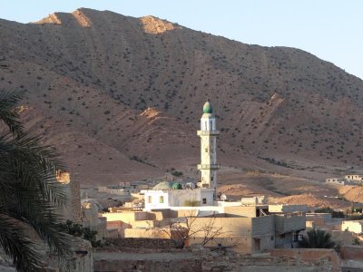 A simple mosque illuminated in the late afternoon.