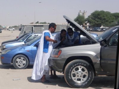 Typical scene in Mauritania:  men working on their vehicles.