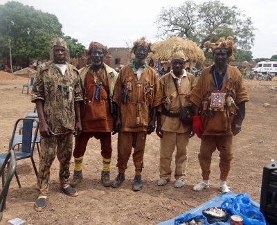 Dozo men; these men are a secret society of hunters and policemen.