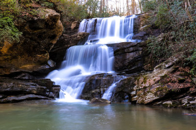 Little Bradley Falls of Saluda North Carolina is reachable via a short hike through the woods.  There are a couple creek crossings though so expect to get your feet wet getting there.