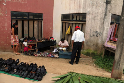 A COBBLER PRACTICING HIS TRADE