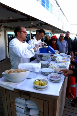 ANOTHER TRADITION: A LAVISH INTERNATIONAL BUFFET ON THE POOL DECK