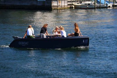 GIRLS HAVING A LITTLE WINE PARTY ON THE WATER