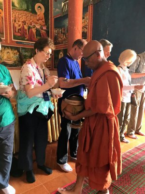 Buddhist Monastery - Giving rice to the  Monks 