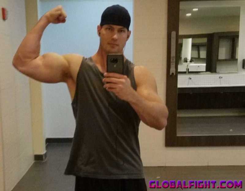 cute guy flexing gym.jpg