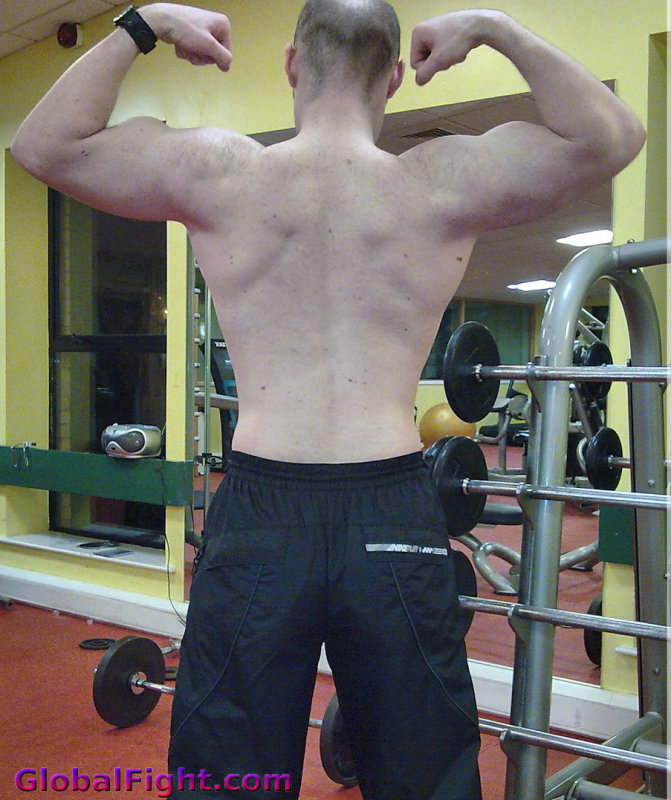 flexing his back muscles.jpg