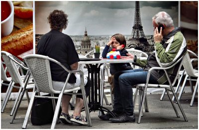 Father & son playing a telephone-conversation with mobile and toy old fashioned one