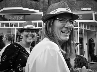 Two smiling hat ladies