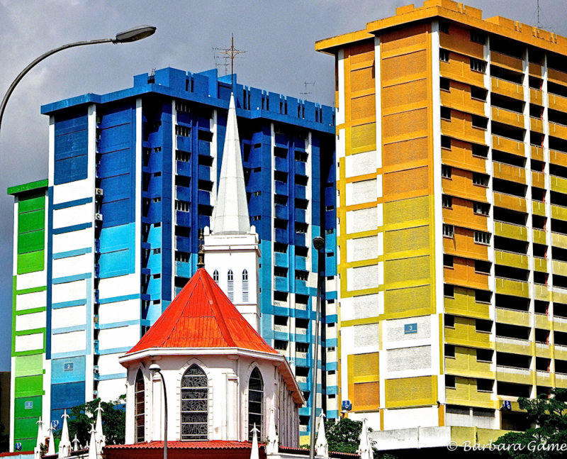 Old church and colourful apartment buildings