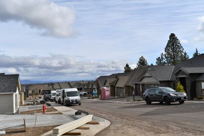 Model home has the larger sign