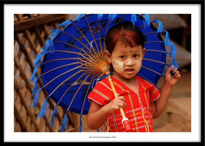 Little girl with umbrella, Mandalay, Myanmar 2014