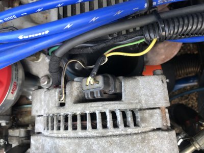 ford 3-wire alternator.  Green goes to the instrument cluster red.  Yellow directly to a fused 12v connection