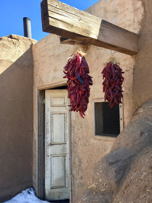 Peppers and white door