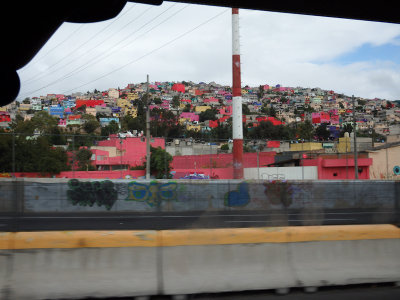 Flying past the colourful housing in Mexico City