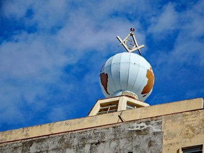 World globe on top on a building left over from Russian days