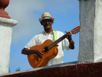 28 Local playing his guitar at the Hill of the Cross  11 Oct 16.jpg