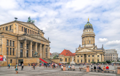 The Gendarmenmarkt French Cathedral is on the right side