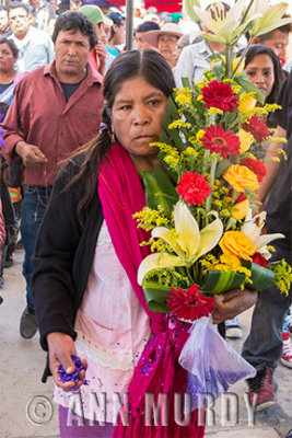 Pilgrim carrying floral bouquet