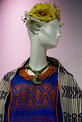 Dress form with coral and jade necklace