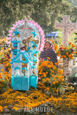 Mother sitting at tomb