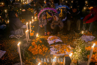 Family gathered around the tomb