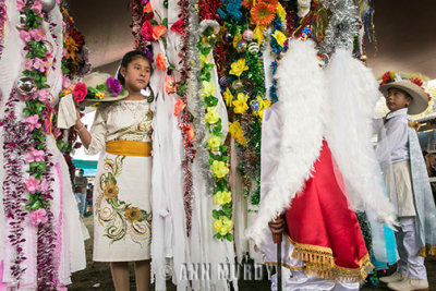 Girl greeting San Miguel