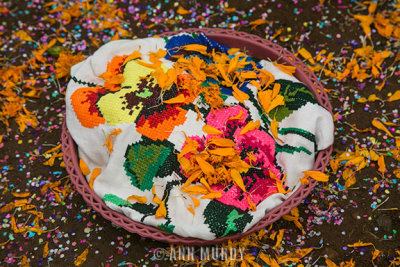 Canasta with marigold petals and confetti