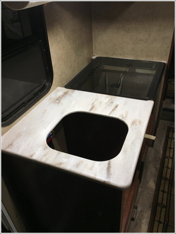 Counter set in place - stove removed but stove cover in place