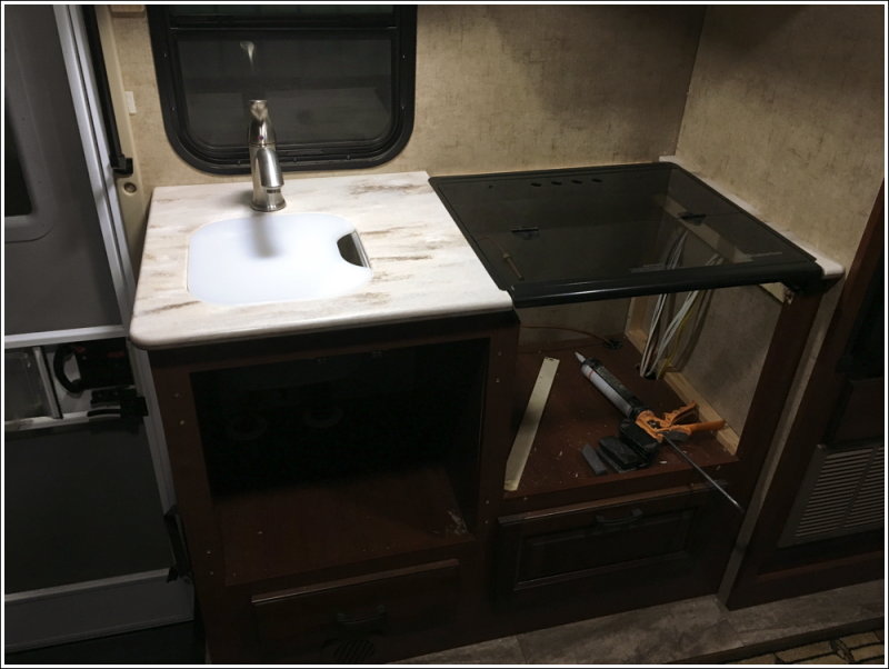 Countertop glued in place - stove removed but stove cover in place