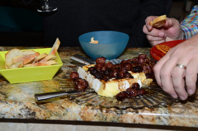 Warm Brie Topped With Dark Grapes.