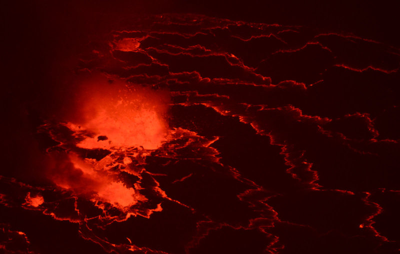 Zoom in on lava fountains bursting through the surface of the lava lake, a true vision of hell