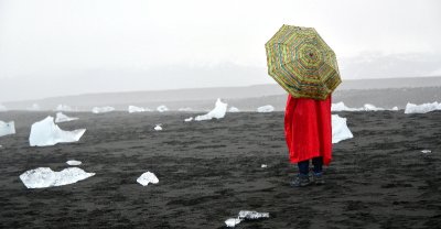 Tourist  with icebergs at Diamond Beach,  by Jkulsrln glacial lagoon, Iceland 805 