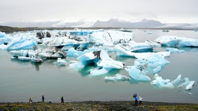Tourists and icebergs at  Jökulsárlón glacial lagoon, Iceland 1200 