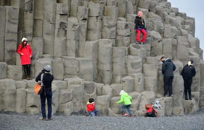 Tourists and Column Basalts at Reynisfjara is a world-famous black-sand beach, Vik, Iceland 1690 