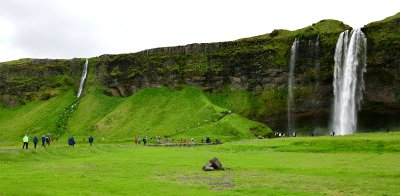 Visitors at Seljalandsfoss waterfalls, Iceland 