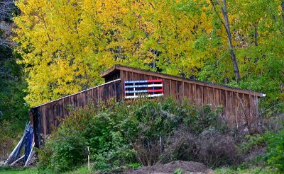 US Flag on pallet against barn, Harpswell, Maine 185