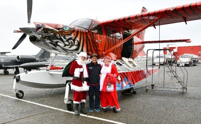 Flying Santa and Mrs Claus in Bad Kitty Kodiak Quest airplane 150a 