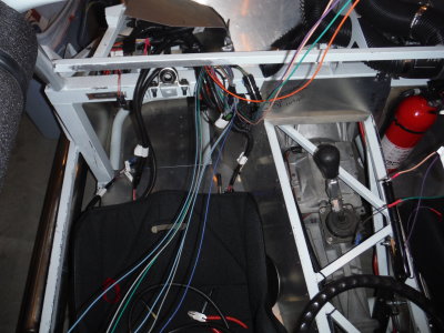 Sensor wires for oil pressure and coolant temperature run inside the cockpit.