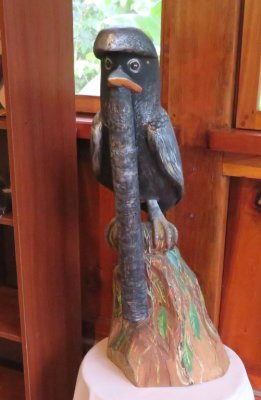 Carving of the Long-wattled Umbrellabird in the dining room at Umbrellabird Lodge, Buenaventura Reserve, Ecuador