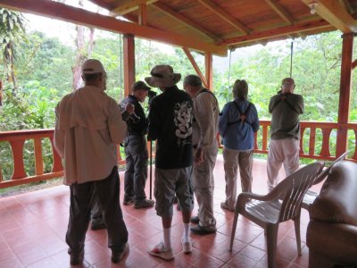 Lelis, Jerry (behind), Allan, Kannan, Michael, Patty and Steve on the open deck at the Umbrellabird Lodge in Buenaventura Reserve in southern Ecuador.
