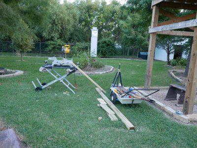 I rolled the miter saw out into the backyard from the garage to save time with cutting the lumber.