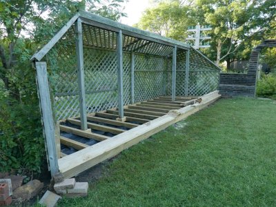 When it stopped raining, I started laying the decking, 2x 6 boards of varying lengths.