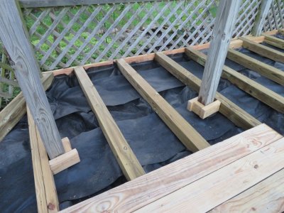 I built braces around each of the posts to have something to screw the decking into and to help support notched decking.