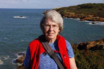 Ruth at the park with lighthouse barely visible in back